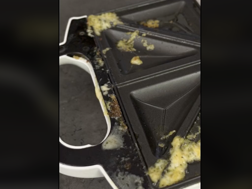 dirty waffle maker in a TikTok video